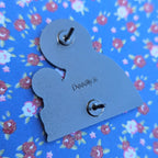 The back of the Pint Baby Enamel Pin with deadly.ie embossing