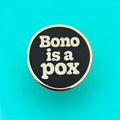 Bono is a Pox Enamel Pin