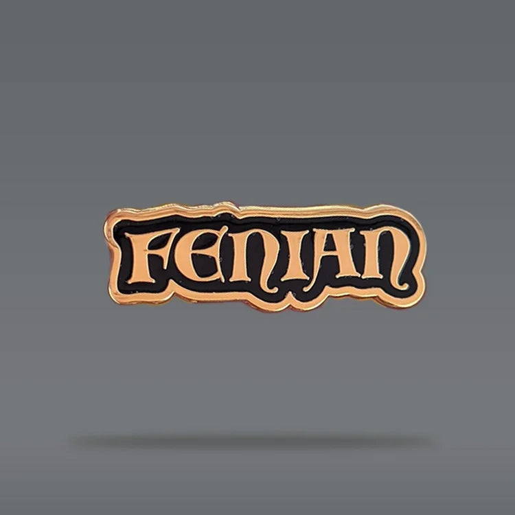A black and gold pin that reads 'Fenian'