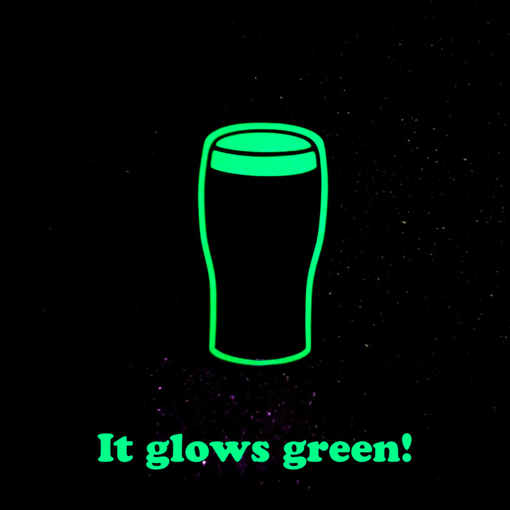 Glowing green outline of a glass with text 'It glows green!' on a black background