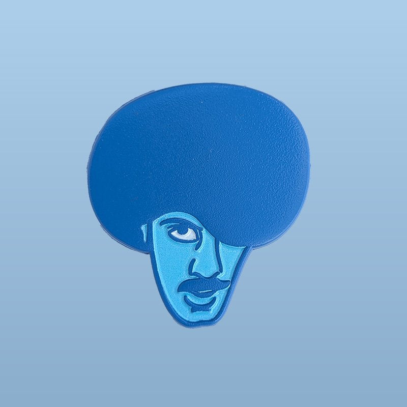 Phil Lynott Enamel Pin in The Dublin Blue Colours on a light blue background