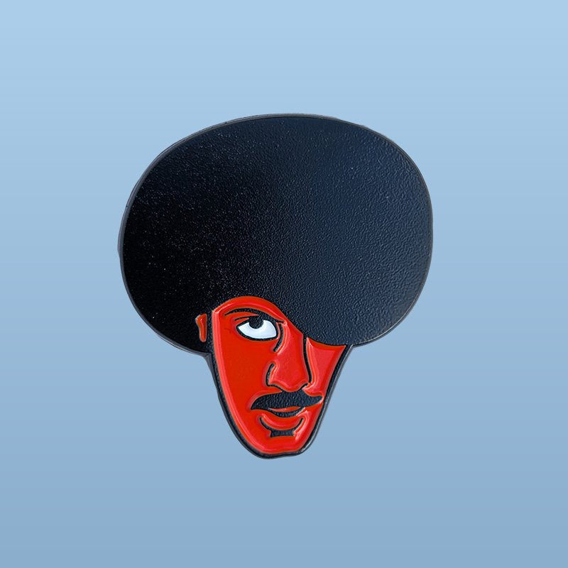 Phil Lynott Enamel Pin in Black and Red similar to the Bohs Colours on a light blue background
