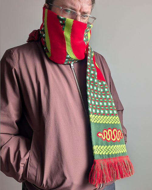 A man wearing the Snakes on a Train scarf from deaadly.ie against a white backdrop