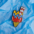 Colorful ice cream cone with the poolbeg towers as flakes, on a crumpled blue paper background