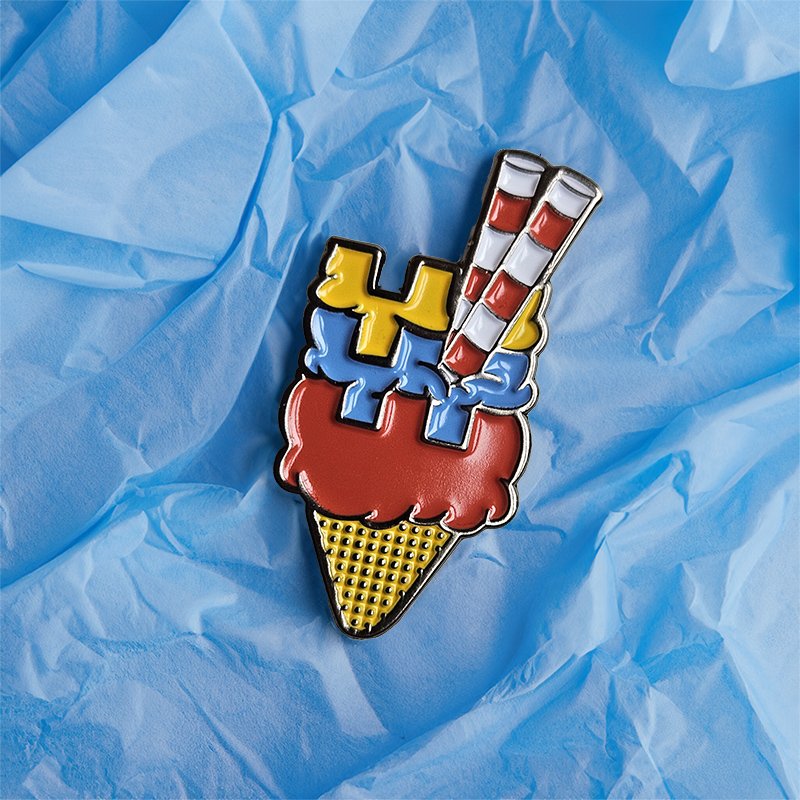 Colorful ice cream cone with the poolbeg towers as flakes, on a crumpled blue paper background